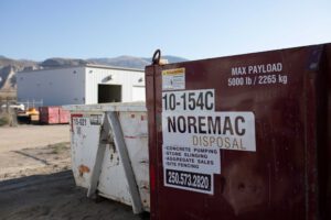 A Noremac Disposal Bin. Max Payload 5000lbs, 2265kg.