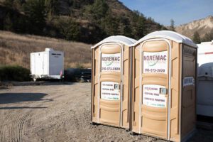 Noremac Environmental porta-potties on a job site.