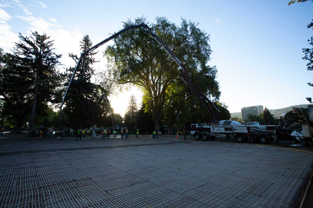 A Normac spider boom in action, the sun setting in the background.