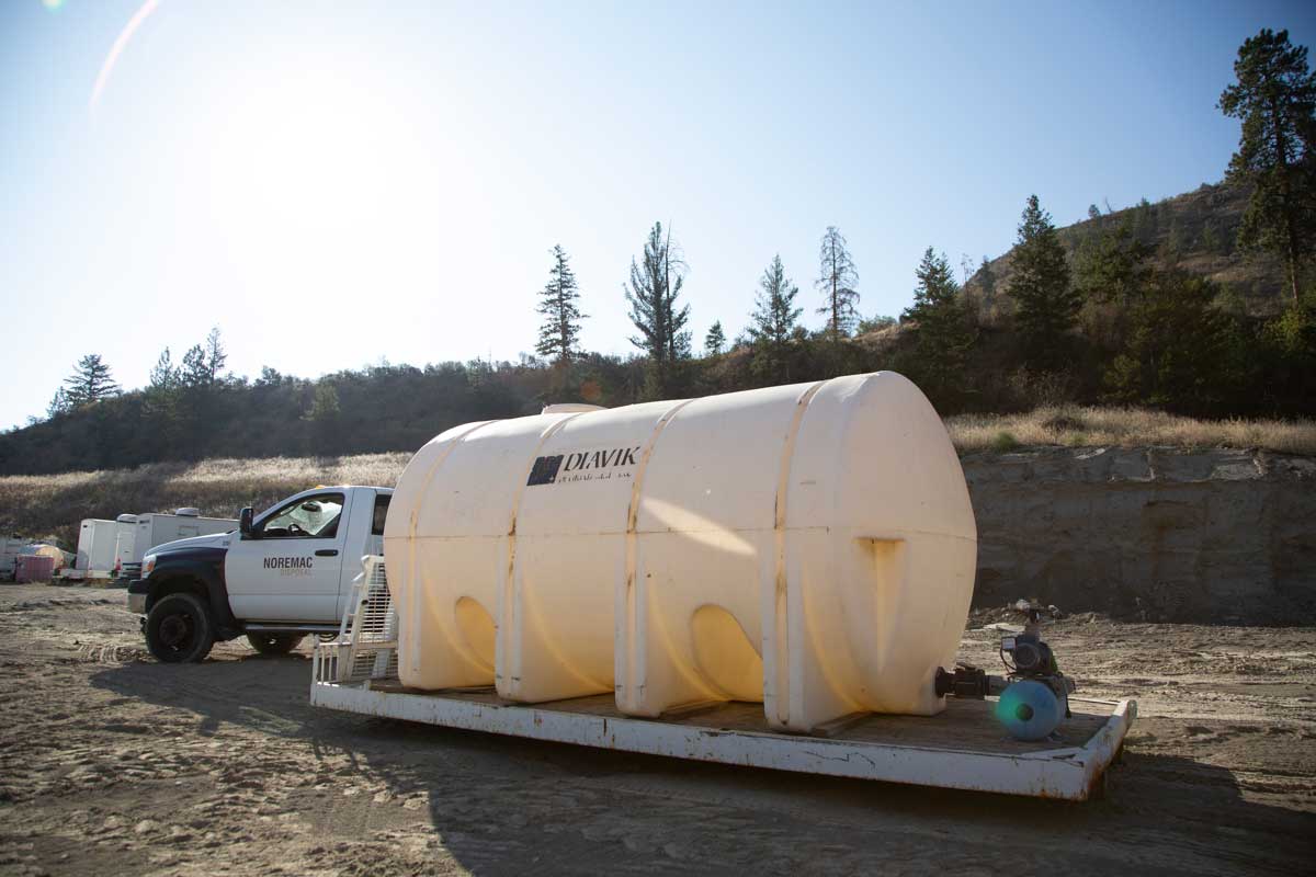 A Diavik water tank, with a Noremac branded F-150 in the background.