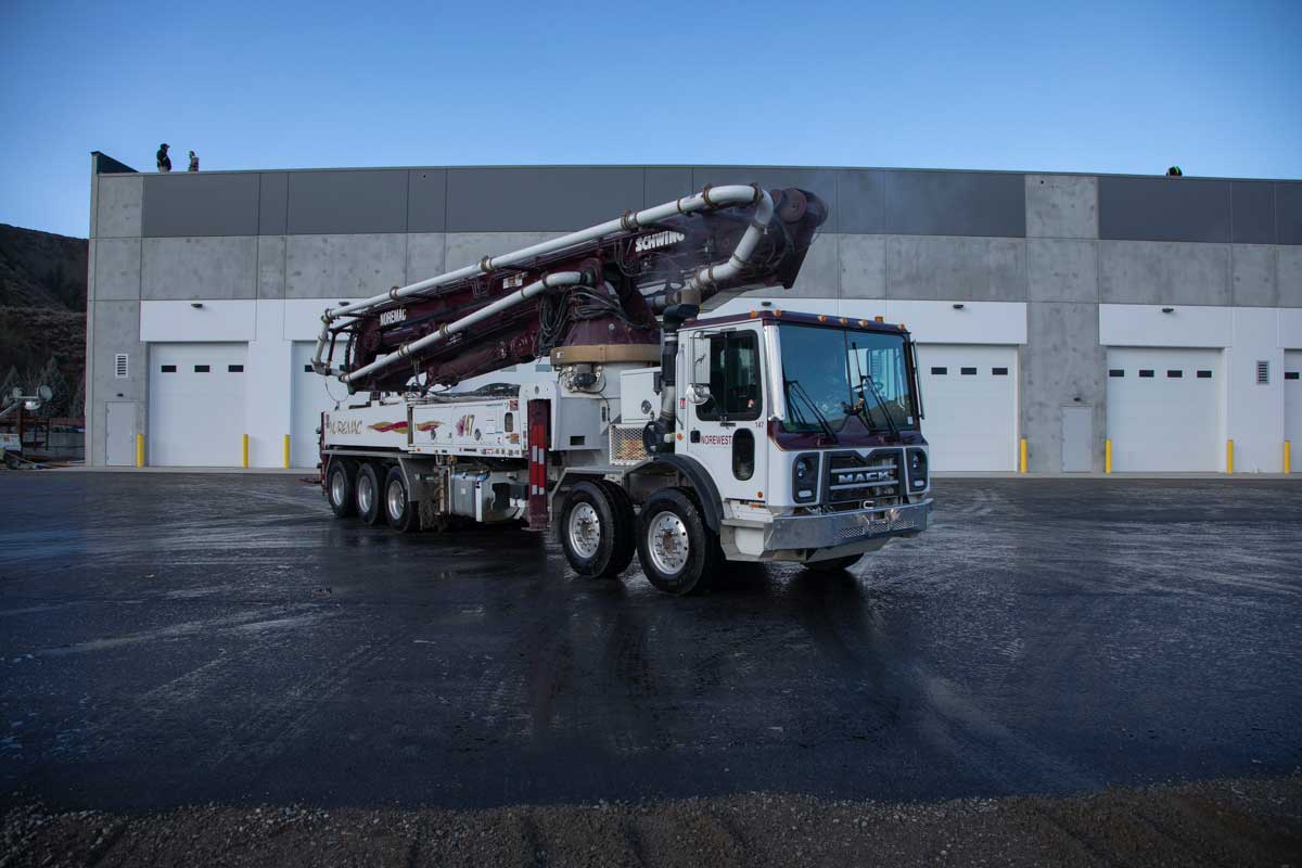 A Schwing 47SX Boom with the Noremac logo on it.