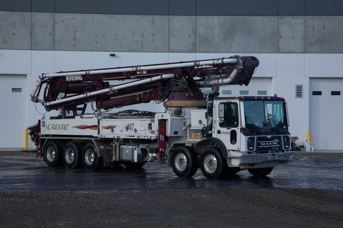 A Schwing 47SX Boom with the Noremac logo on it.