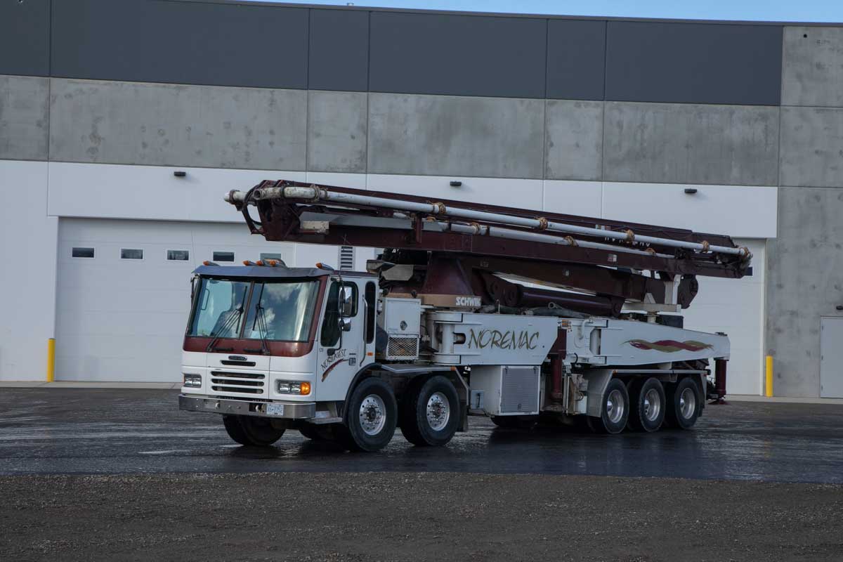 Close up of a Schwing Noremac boom pump.